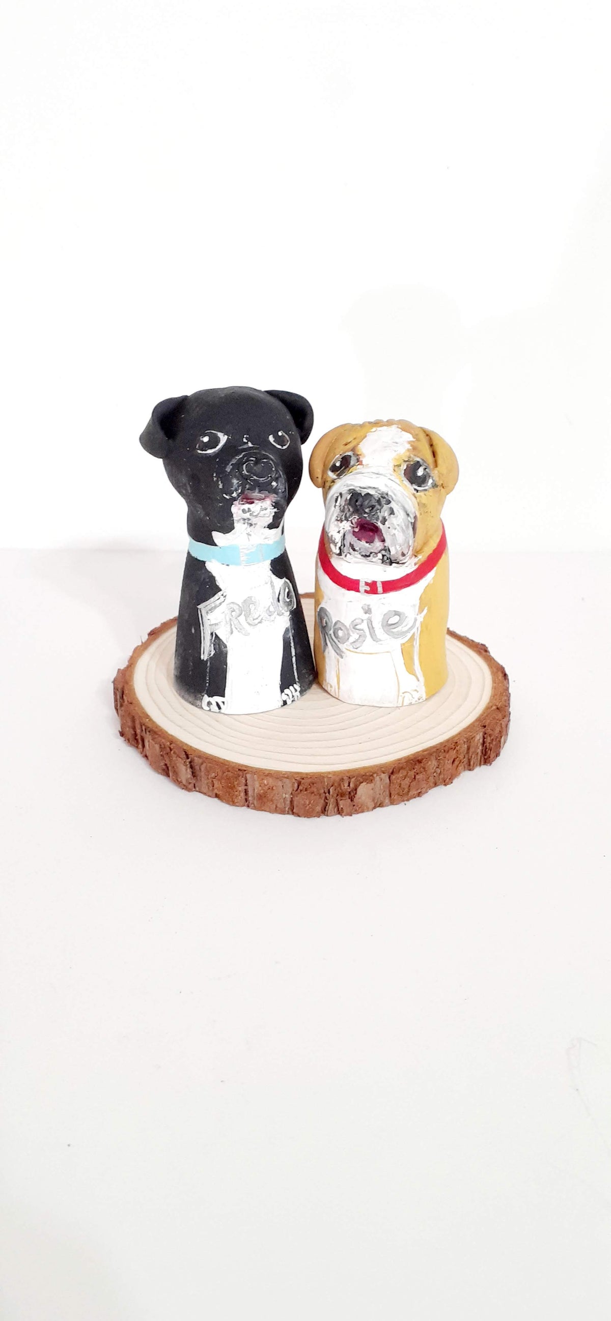 Two sweet peg doll puppies sculpted with clay